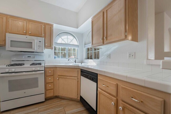 Building Photo - Charming First-Floor Home with Open Living and Private Patio