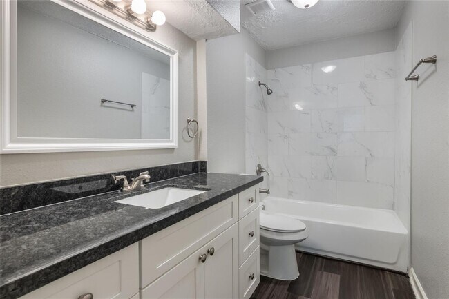 Building Photo - Welcome to this fully remodeled 4/2/2 brick home near Lake Conroe! With new AC/heat, roof, water ...