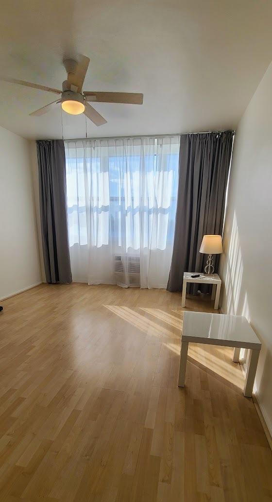 Bedroom with sheer curtains. - 3 Island Ave