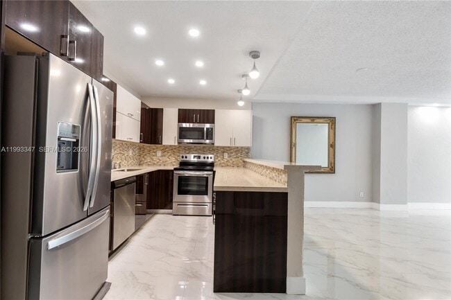 Building Photo - 19380 Collins Ave