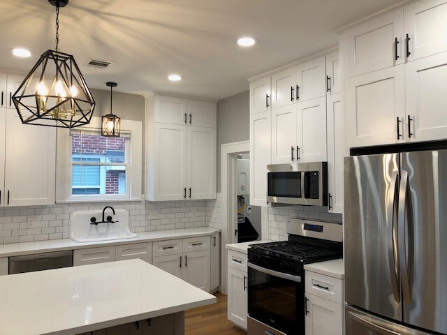 restored original sink, updated lighting fixtures with dimmable features throughout the entire space - 1742 W Main St