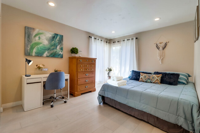 Enjoy lots of natural light in Bedroom 1 w/ a cozy king bed & workspace for productivity - 524 Telegraph Canyon Rd