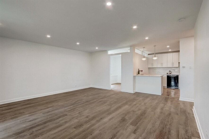 Living room with recessed lights, opens directly to kitchen! - 240 M St SW
