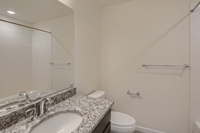 Building Photo - Beautiful 2-story modern townhome available for rent in booming Interquest & Voyager area