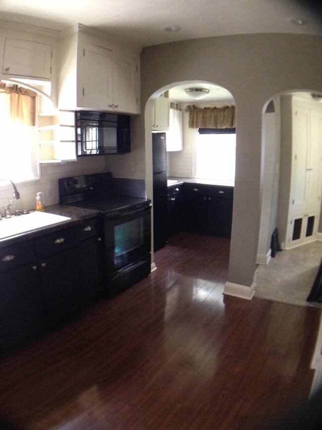 Kitchen has large main sink, smaller second sink next to fridge. - 3239 Wendover