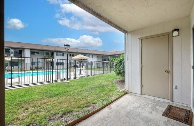 Building Photo - First-Floor 2BR Condo with Pool Access & Covered Parking in La Bonita