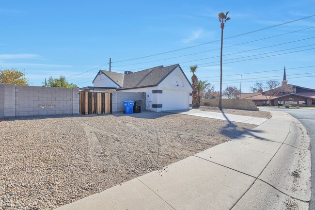 Building Photo - Welcome to this stunning 4-bedroom, 2-bath...