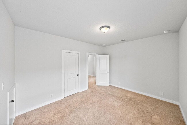 Building Photo - Greenbelt. 3 Car Garage. Built In Dog Room.
