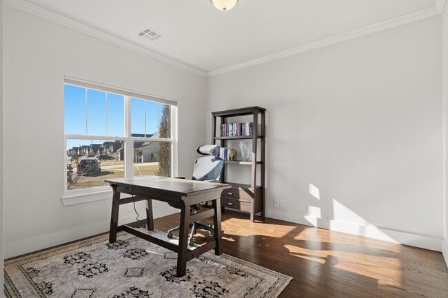 Building Photo - Stunner! This beautiful home features a spacious open floor plan with primary suite and private o...