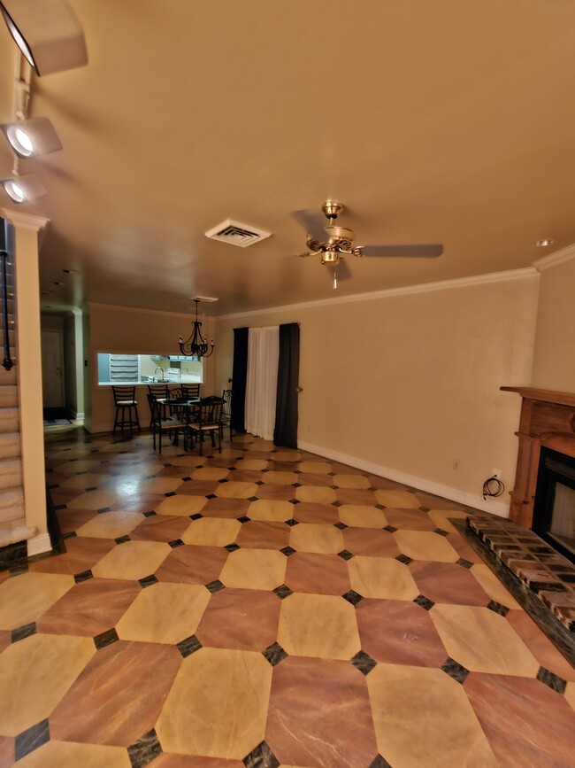 Gorgeous Tuscony-inspired hand-painted cement flooring. Table, chairs & barstools included. - 416 Doucet Rd