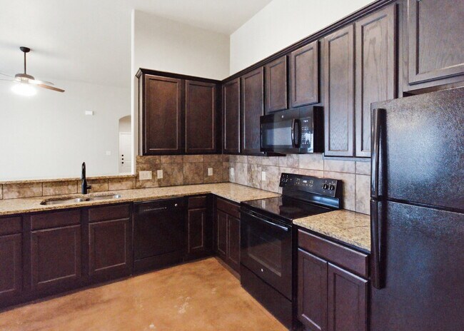 Building Photo - 3 Bedroom Duplex with Stained Concrete Floors and Greenbelt Views!