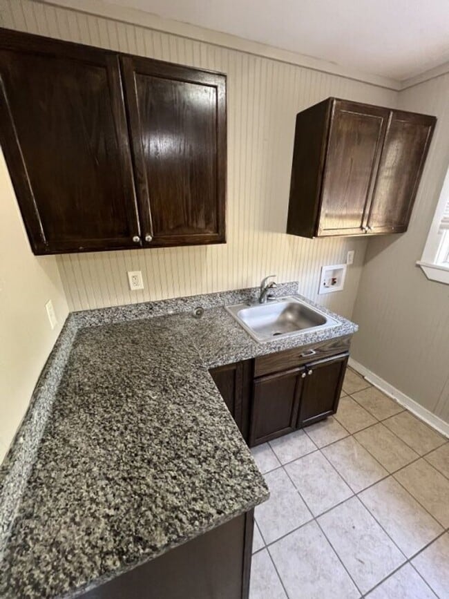 Building Photo - Cozy Brick Home with Covered Parking – Denova St.