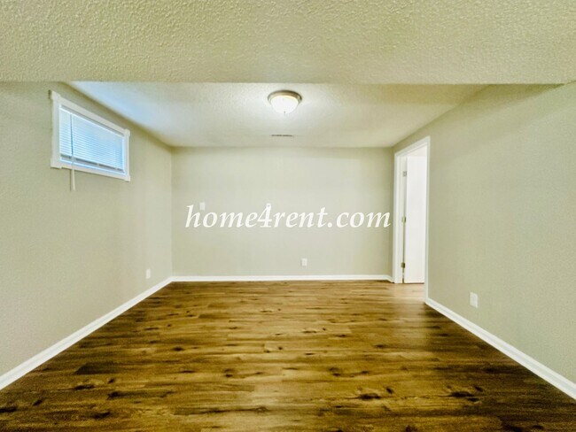 Building Photo - Updated Raytown Ranch w/ Wood Floors, SS Appliances, Finished Basement and a Fenced Yard!