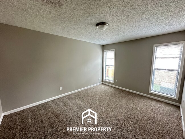 Building Photo - Quiet 3BR/2BA Cove Near Southwind | Soaring Ceilings & Floor-to-Ceiling Stone Fireplace