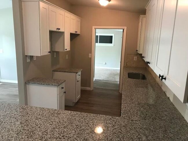 Building Photo - Spacious 4 Bedroom Home With Garage And Modern Updates