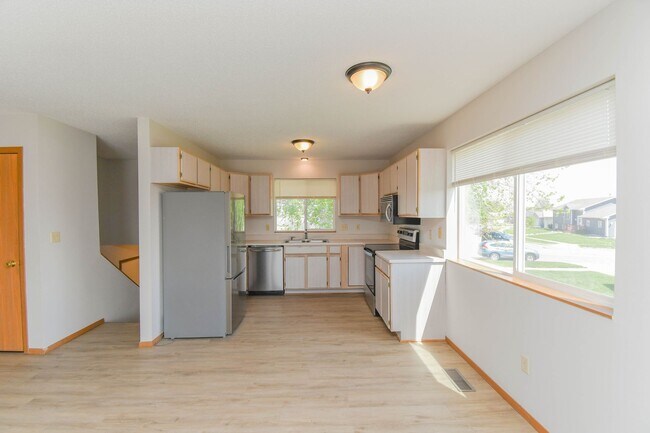 Building Photo - Updated 3BR Split-Level Home with Huge Deck, Fenced Yard & 2-Car Garage Near I-29!