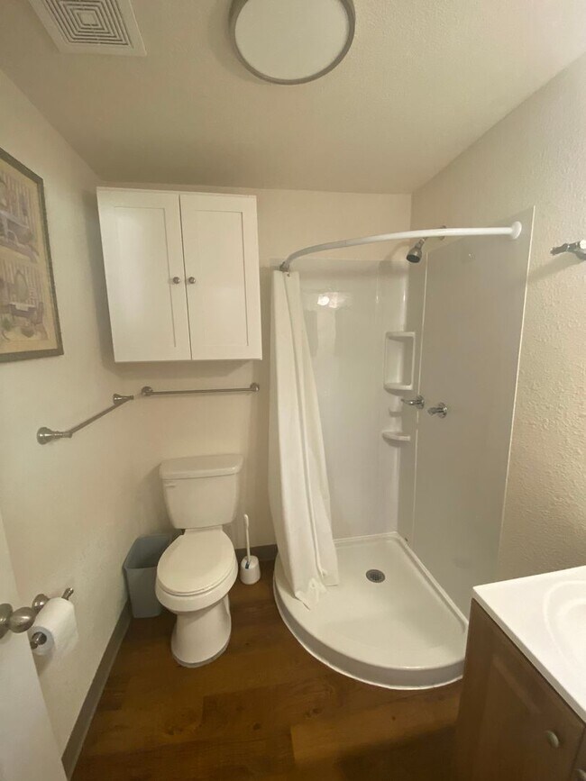 Building Photo - Adorable studio with large garage and work...