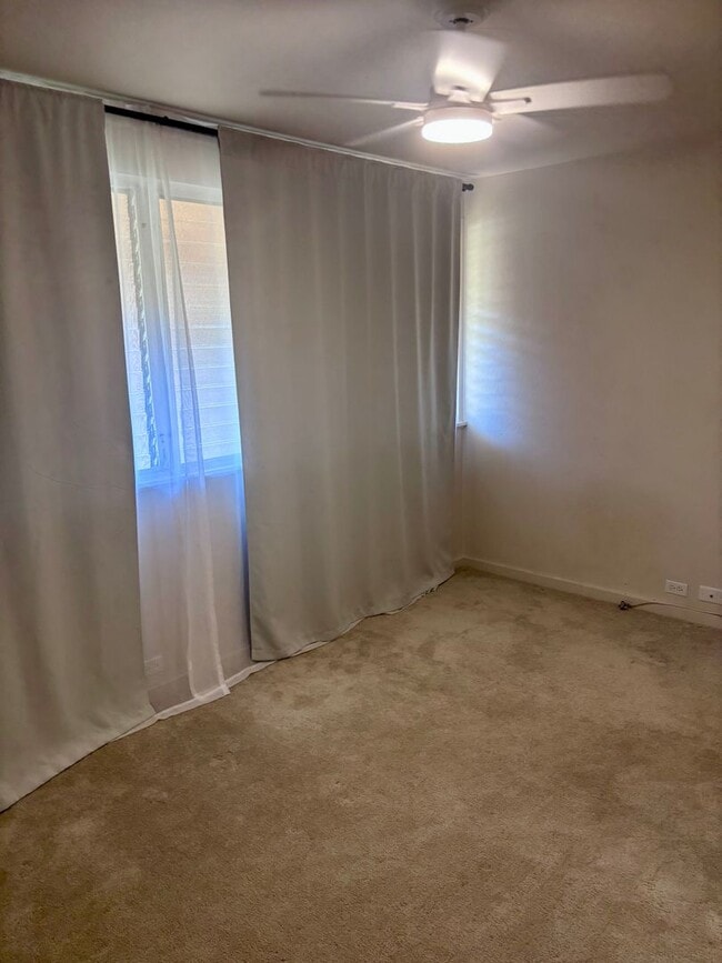 Building Photo - Available Now | 2 Bedroom, 2 Bathroom Townhouse with 1 Assigned Parking Stall at Tropic Gardens 1