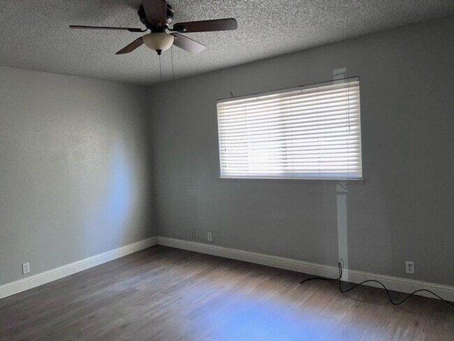 Building Photo - Laminate flooring throughout. Solar panels...