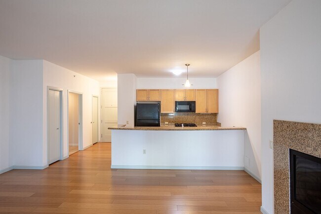 Building Photo - Sweet + secure 1/1 condo with parking, extra storage room + AC available now!