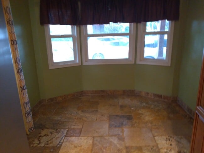 In kitchen eating area. - 6601 Louise Ave