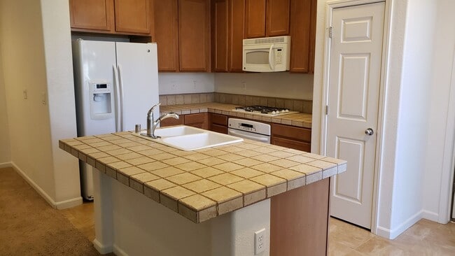 Building Photo - RENT JUST REDUCED TO $2,100 PER MONTH FOR THIS SPACEIOUS 2 BEDROOM, 2 BATHROOM CONDO WITH GARAGE ...