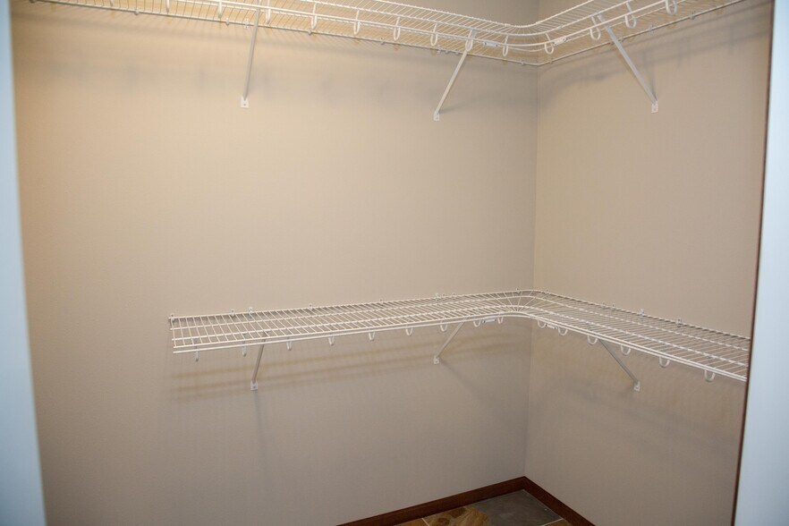 Primary bedroom walk-in closet - 6353 Pawnee Ln