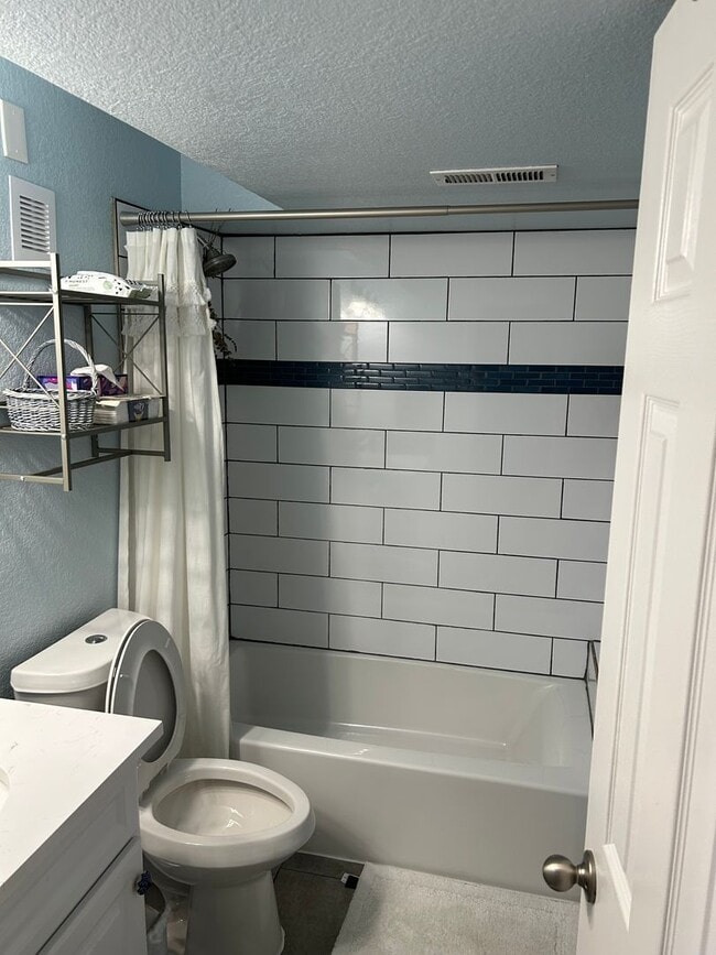 Building Photo - Rare 4BR End-Unit in Northpark with Finished Basement and 2-Car Garage