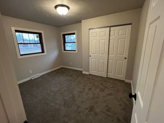 Building Photo - Spacious 4-Bedroom Home with Finished Basement & Garage