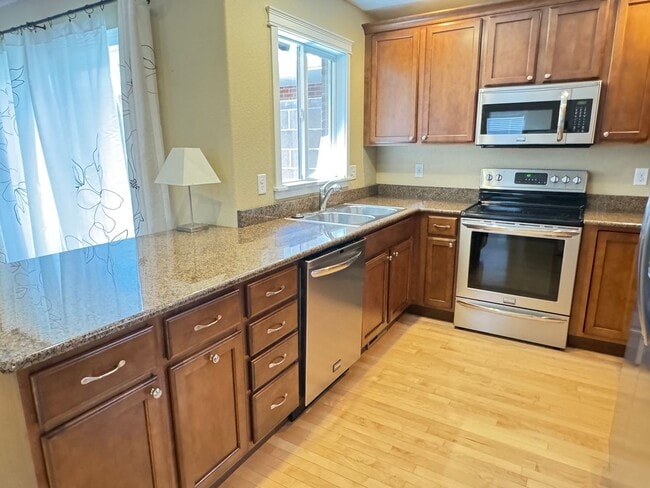 Building Photo - 4 BEDROOM, 3 BATHROOM TWINHOME WITH 2 CAR ATTACHED GARAGE IN NORTH CHEYENNE