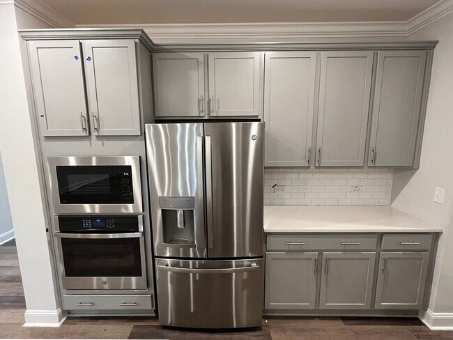 Building Photo - Newly Built 4BD, 3BA Cary Townhome with Modern Amenities and Screened-In Patio