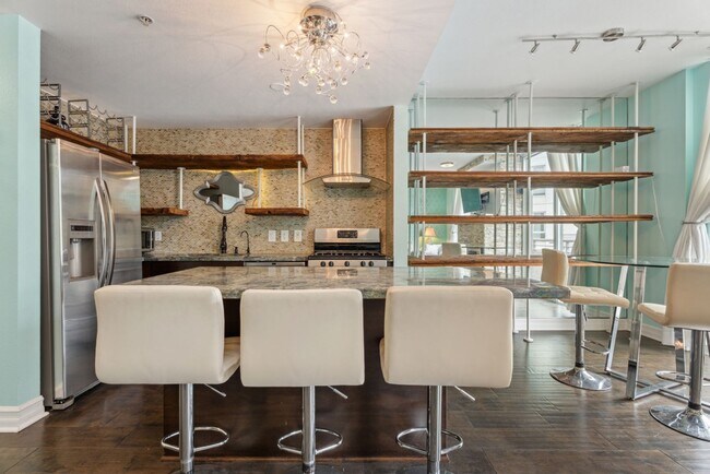 Building Photo - Modern 2-Bedroom Condo with Premium Amenit...
