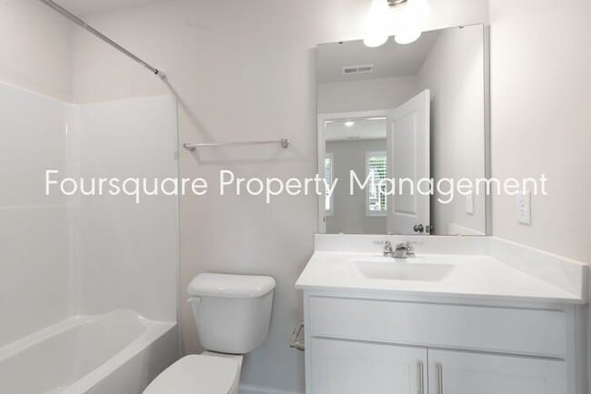 Building Photo - Stylish 3-Level Townhome with Bonus Suite, Deck & Garage – Near I-540 and Shopping