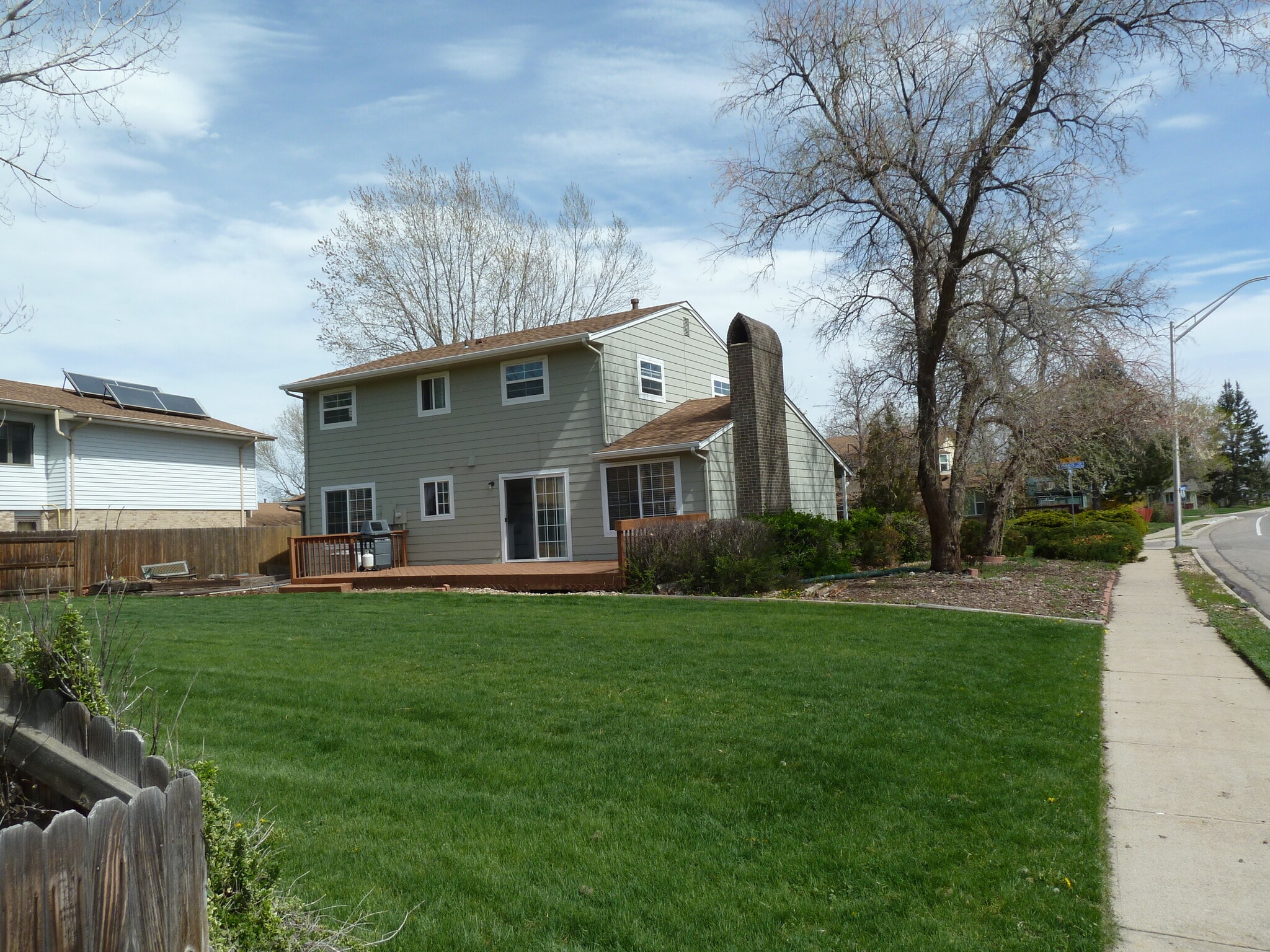 Currently there is a short black garden fence between the sidewalk and house that encloses back yard. It may be removed at request of new tenant. - 8205 Ingalls Cir