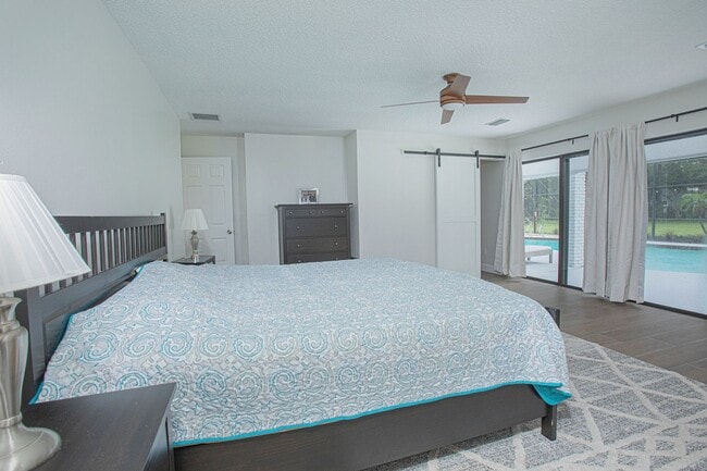 Building Photo - Beautifully Updated 3/2 Pool Home with Large Backyard in Lake Ajay (Gated Community)