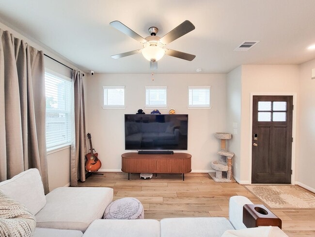 Building Photo - A true gem on a quiet corner lot, this spacious and sun-filled home is tucked away from street no...