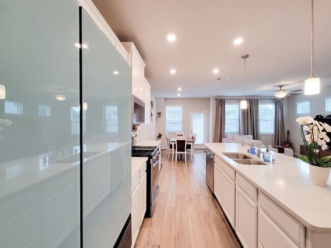 Building Photo - A true gem on a quiet corner lot, this spacious and sun-filled home is tucked away from street no...