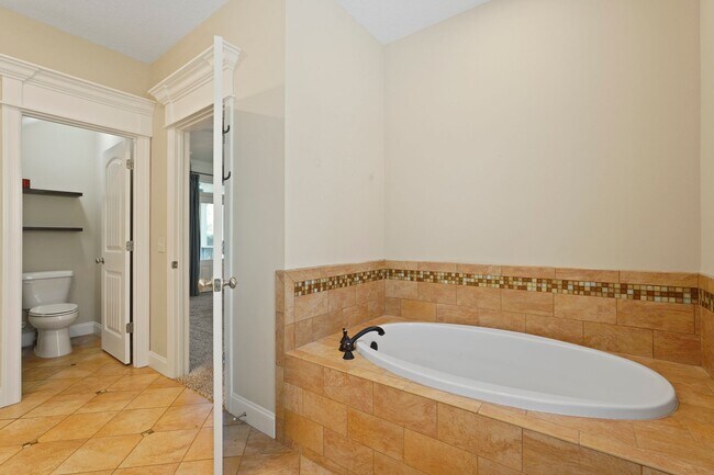 Building Photo - 3 Bedroom Dunham Marsh Beauty with Outdoor Fireplace and Resort-Style Community Amenities