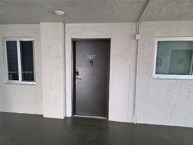 Building Photo - 9917 W Okeechobee Rd