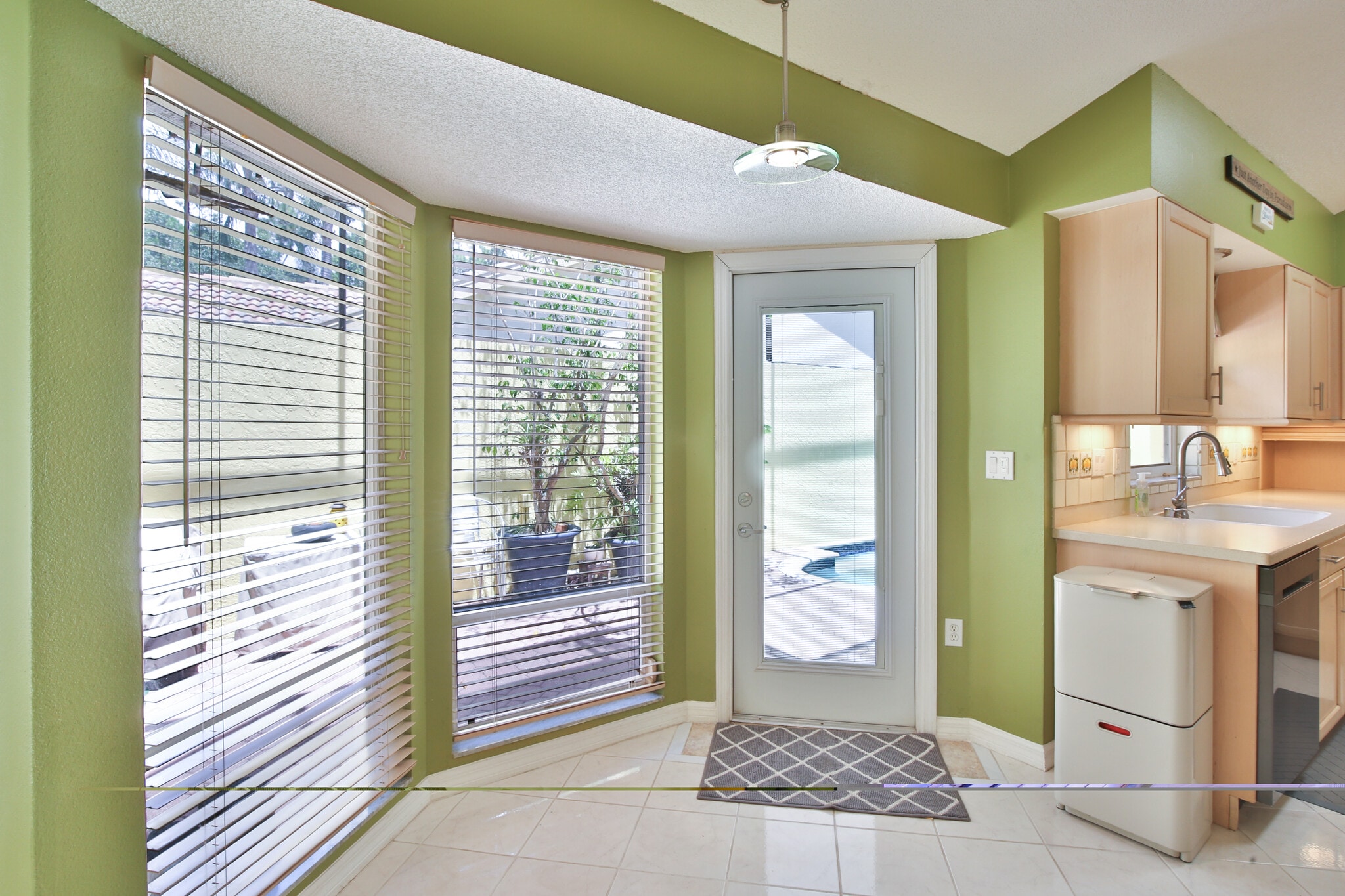 Walk out to pool/lanai from kitchen - 4700 Tivoli Ave