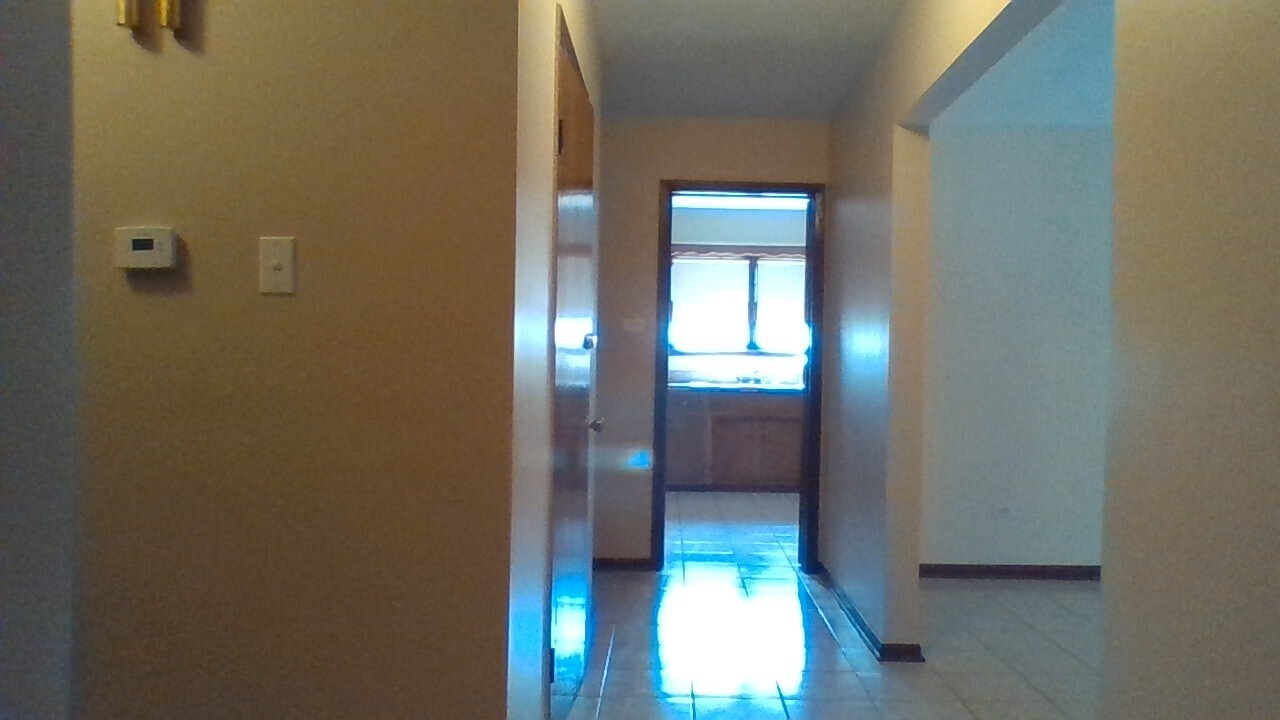 Kitchen, Living room right, BR & Bath left - 2214 N 74th Ct