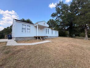 Building Photo - Discover this spacious 3-bedroom, 2-bathroom house in Atkins, AR