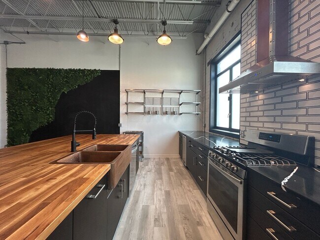 Building Photo - Industrial Style. Downtown Energy. Elevated Living.