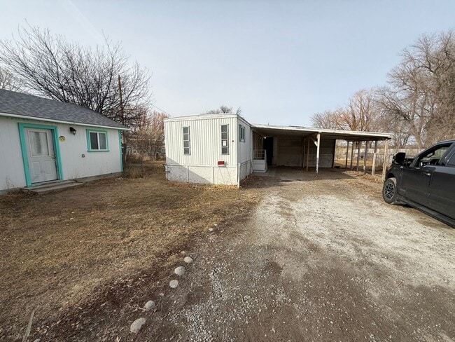 Building Photo - 2 Bedroom 1.5 Semi-Rural Mobile Home with Workshop on Large Lot