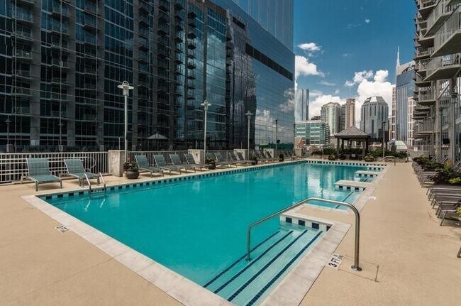 Building Photo - Stunning condo in the heart of SoBro at the Encore! Beautiful 1 bed, 1 bath on the amenity floor ...