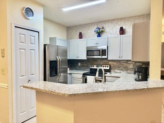 Building Photo - Turnkey and Move-in ready! Fully Furnished...