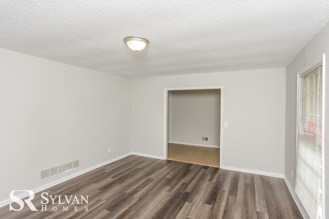 Building Photo - Come view this charming brick home