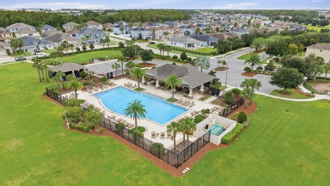 Building Photo - Spacious 6-Bedroom Home Near Lake Nona | 3-Car Garage + Tesla Charger