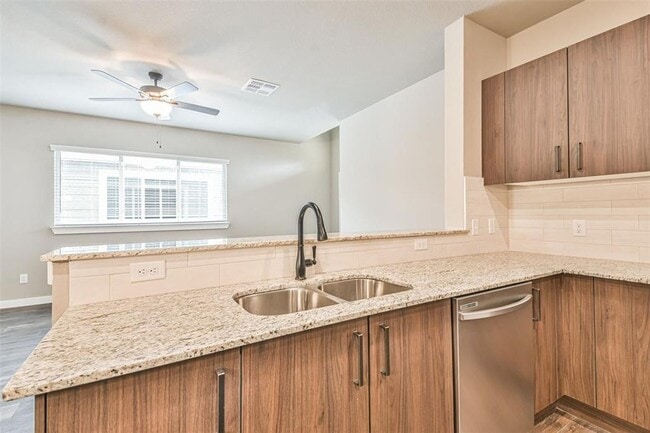 Building Photo - Modern 3-Bedroom Duplex with Granite Counters, Private Yard, and Prime Location