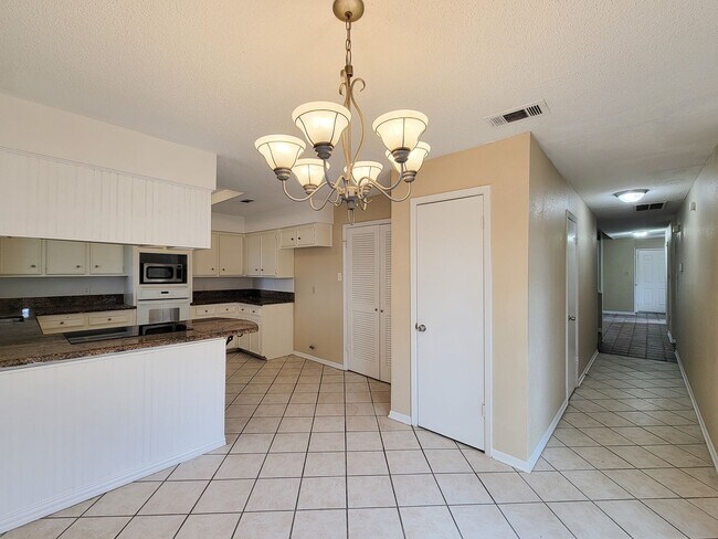 Building Photo - Come and view this open floor plan with much potential. Formal and dining room, granite counters,...